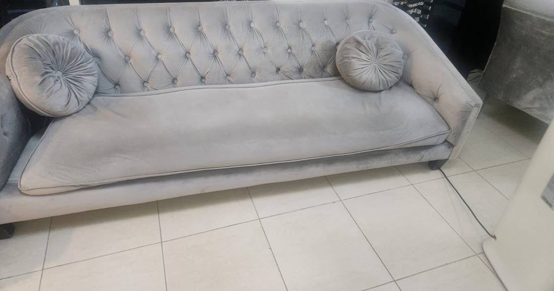 Grey three-seater sofa